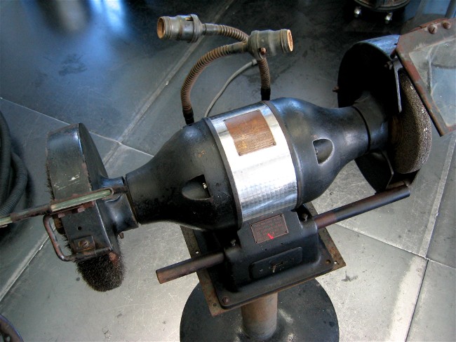 What is a bench grinder used for?